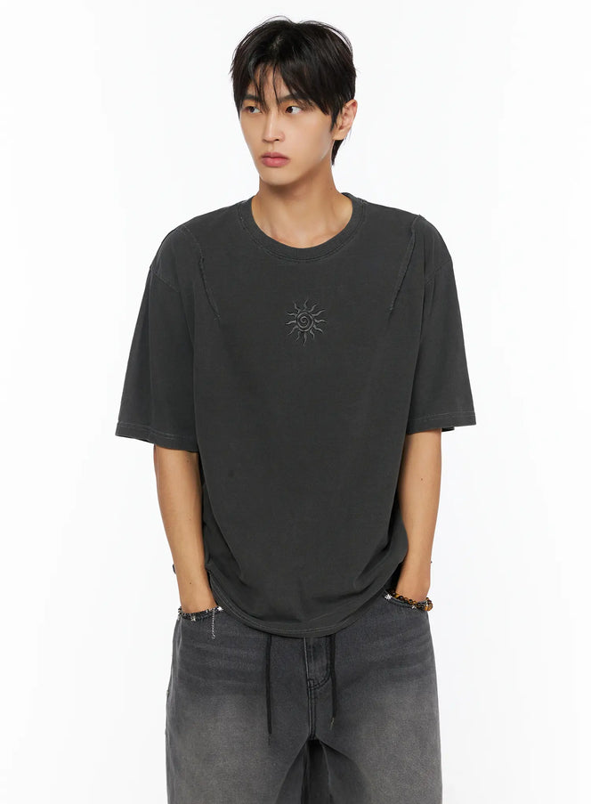 Men's Sun Embroidery T-Shirt IL520 dark gray close-up front shot on male model hands in pockets showing sun embroidery detail