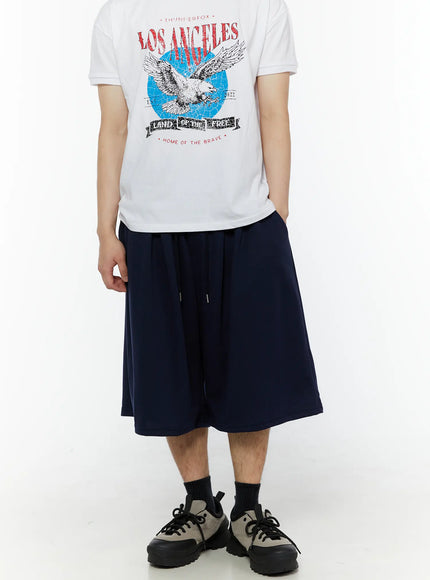 Men's Swirl Print Back Pocket Shorts (Dark Blue) IL509 Dark Blue front view on male model styled with graphic print tee showing drawstring waist and wide-leg shape