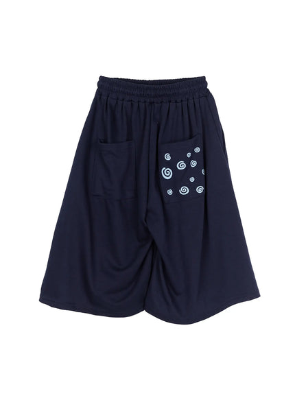 Men's Swirl Print Back Pocket Shorts (Dark Blue) IL509 Dark Blue flat-lay back view showing dual back patch pockets with light blue swirl graphic print on navy jersey