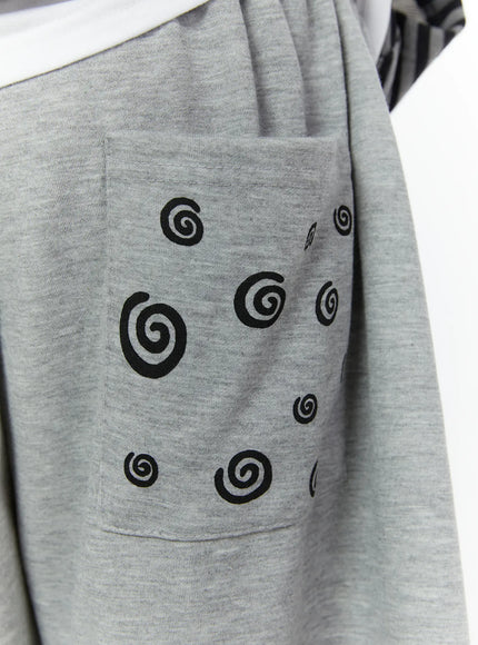 Men's Swirl Print Back Pocket Shorts (Gray) IL509 Gray close-up detail of black swirl pattern printed across patch pocket on cotton-blend fabric