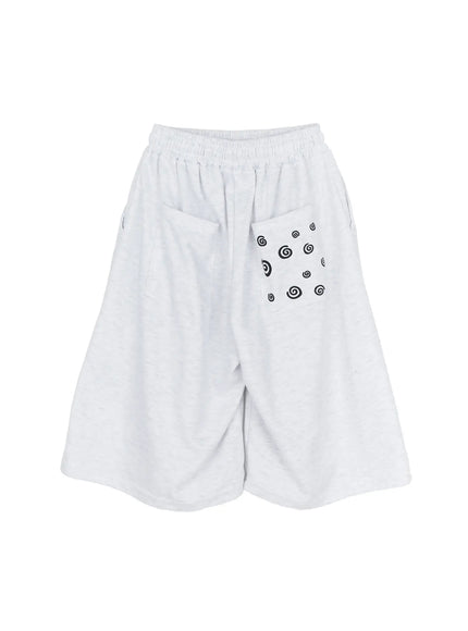 Men's Swirl Print Back Pocket Shorts (Light Gray) IL509 flat-lay back showing black swirl graphic printed patch pocket on heathered gray wide-leg shorts