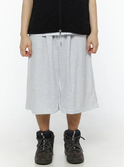 Men's Swirl Print Back Pocket Shorts (Light Gray) IL509 front close-up on model showing drawstring elastic waistband and wide-leg heathered cotton fabric