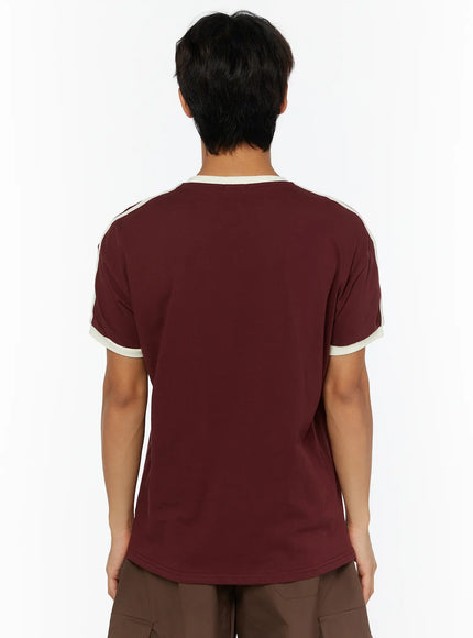 Men's Track Graphic T-Shirt IL507 Burgundy back view on model, showing clean plain back, cream ribbed collar and cream stripe detail along sleeves
