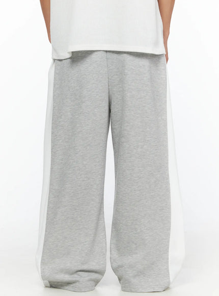 Men's Two-Tone Sweatpants IL528 Gray back shot on model showing rear view wide-leg silhouette white side panels center back seam and elastic waistband detail
