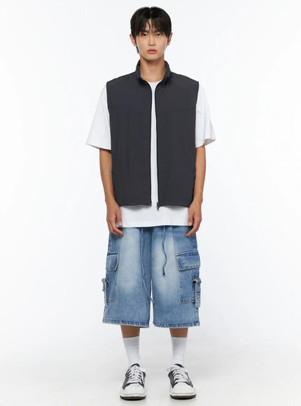 Men's Two-Way Anorak Vest IL515 Dark gray full-length front shot on male model standing upright with white tee, cargo denim shorts, and sneakers