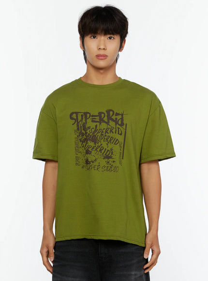 Men's Typography Graphic T-Shirt IL513 Green front shot on male model standing neutral pose displaying full graffiti SUPERRID typography chest print cotton tee