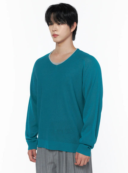 Men's V-Neck Knit Sweater IL502 Mint side shot on model showing V-neck neckline detail grey inner layer visible fine knit texture raglan sleeve