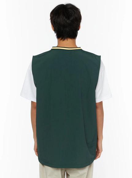 Men's Varsity Style Graphic Tank IL509 green back shot on male model showing plain smooth back panel with yellow black white striped V-neck collar detail