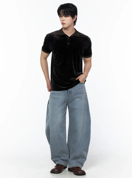 Men's Velvet Polo Shirt IL502 Black full-body three-quarter front shot on model hand in pocket looking away styled with wide-leg jeans