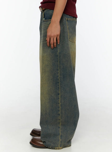Men's Vintage Baggy Jeans IL510 Blue side view on model showing full leg length, yellow-tinted fading along outseam, back pocket visible, worn with brown loafers