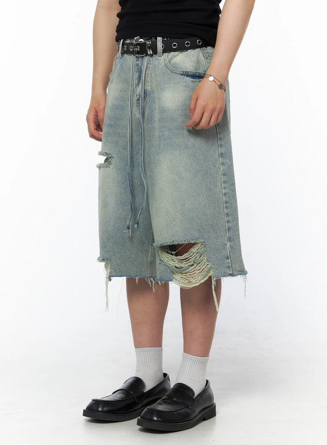 Men's Vintage Distressed Jorts IL502 Light blue side-angle view on model with distressed tears and frayed drawstring detail styled with black belt