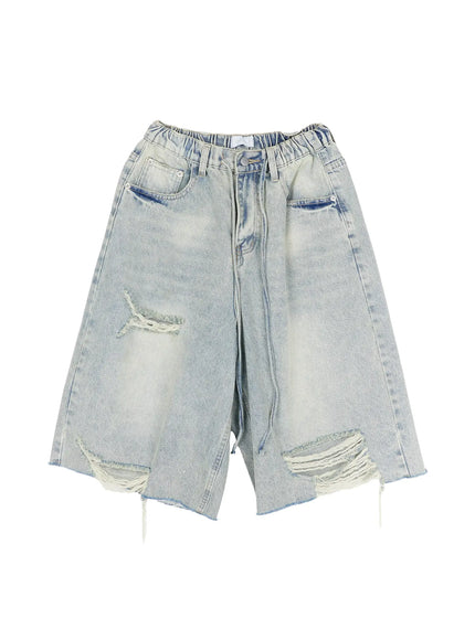 Men's Vintage Distressed Jorts IL502 Light blue flat-lay front showing elastic waistband wide-leg cut multiple ripped holes frayed threads and raw hem