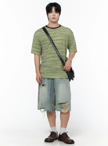 Men's Vintage Distressed Jorts IL502 Light blue full-body front view on model styled with green striped tee and crossbody bag showing wide-leg silhouette