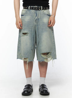 LEWKIN Men's Vintage Distressed Jorts IL502 Light blue front view on model wearing black belt and loafers showing ripped holes and frayed hem M/L
