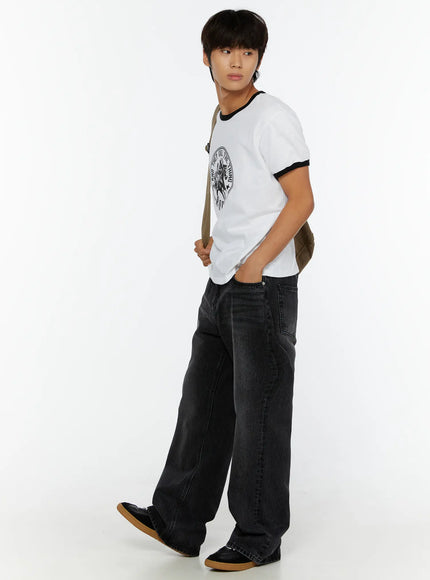 Men's Vintage Rodeo T-Shirt IL513 White side lifestyle shot on male model walking holding canvas crossbody bag hand in pocket styled with wide-leg jeans