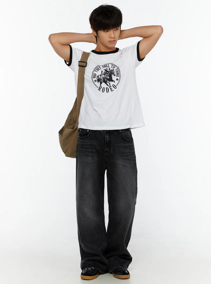 LEWKIN Men's Vintage Rodeo T-Shirt IL513 White full-body lifestyle shot on male model hands behind head styled with wide-leg black denim and canvas crossbody bag