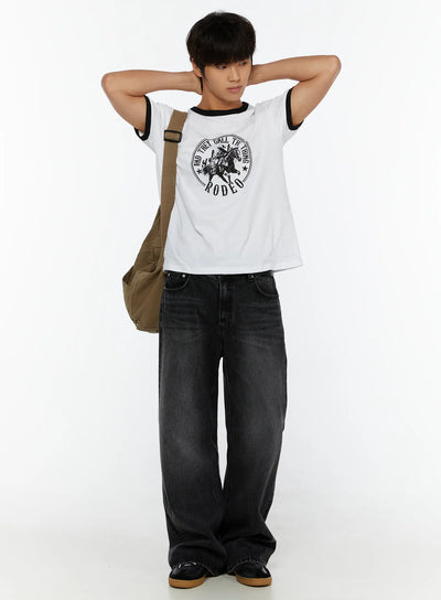 LEWKIN Men's Vintage Rodeo T-Shirt IL513 White full-body lifestyle shot on male model hands behind head styled with wide-leg black denim and canvas crossbody bag