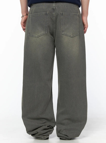 Men's Vintage Semi-Wide Jeans IL502 Gray full-body front shot on model in olive Henley knit, arms at sides, showing relaxed wide-leg denim with washed gray tone