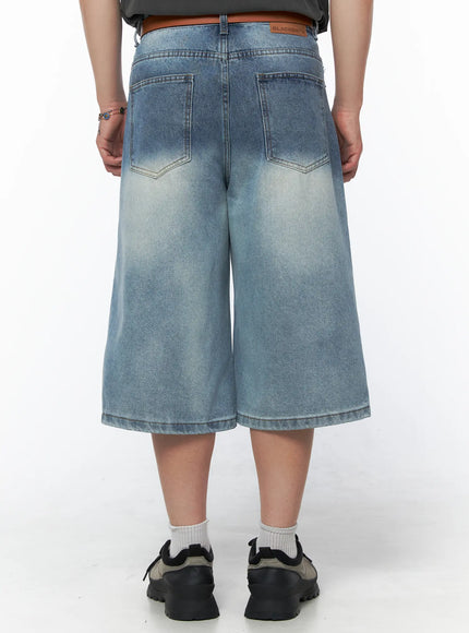 Men's Vintage Wash Jorts IU523 Light blue back close-up on model showing dual back pockets, faded wash, brand patch on waistband, and wide-leg hem