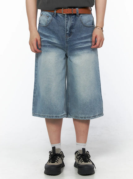 Men's Vintage Wash Jorts IU523 Light blue front close-up on model wearing brown belt and gray tee, wide-leg washed denim shorts, size M