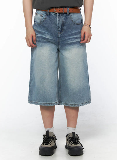 Men's Vintage Wash Jorts IU523 Light blue front close-up on model wearing brown belt and gray tee, wide-leg washed denim shorts, size M