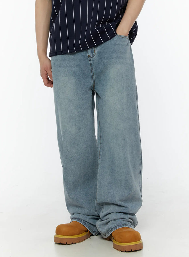 LEWKIN Men's Vintage Washed Wide Leg Jeans IL509 Light blue size S — side shot on male model, hand in pocket, styled with navy striped polo and tan boots