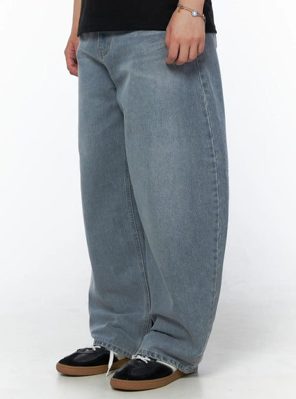Men's Vintage Wide Leg Jeans IL502 Light blue side view on model styled with black velvet polo shirt and brown loafers, full-body shot