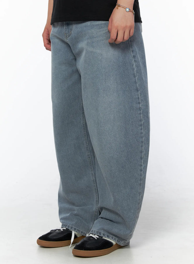Men's Vintage Wide Leg Jeans IL502 Light blue side view on model styled with black velvet polo shirt and brown loafers, full-body shot