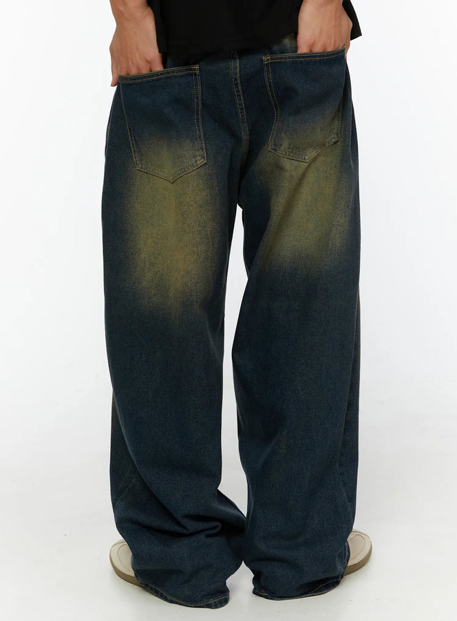 Men's Vintage Wide Leg Jeans IL510 indigo blue back shot on male model hands in pockets, dual back patch pockets with yellow-green vintage wash wide leg denim