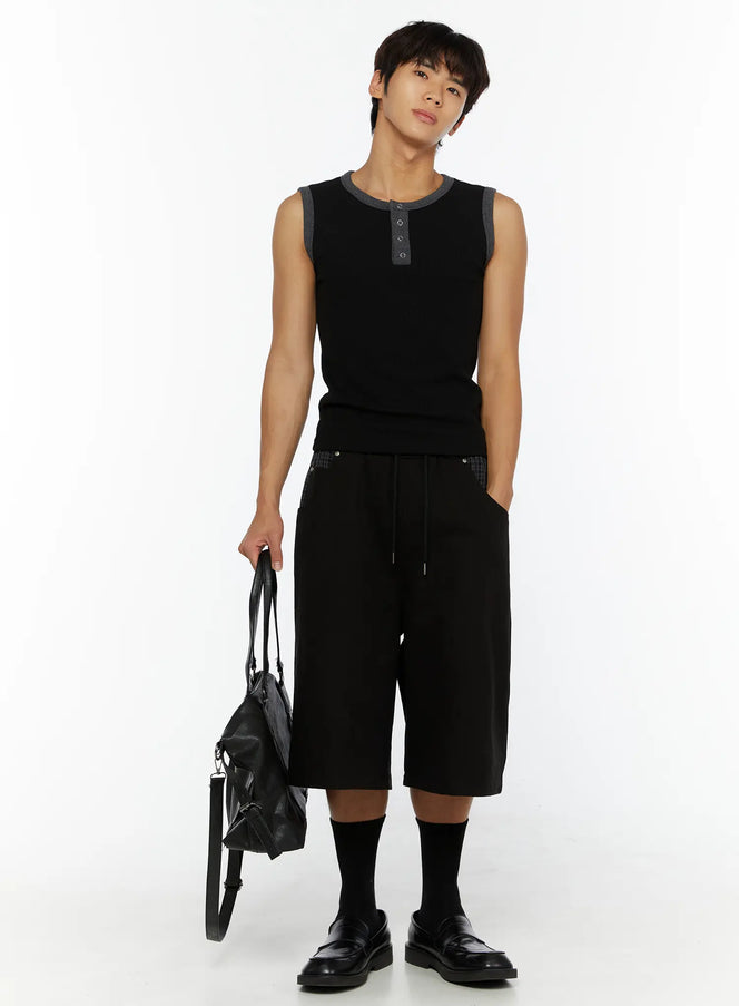 Men's Waffle Contrast Henley Tank IL507 Black full-body front shot on model holding leather bag, gray contrast trim, styled with black shorts