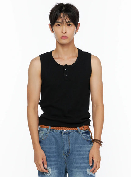 Men's Waffle Knit Henley Tank IL520 black close-up front shot on male model showing henley button placket ribbed waffle knit texture styled with blue distressed denim and braided belt