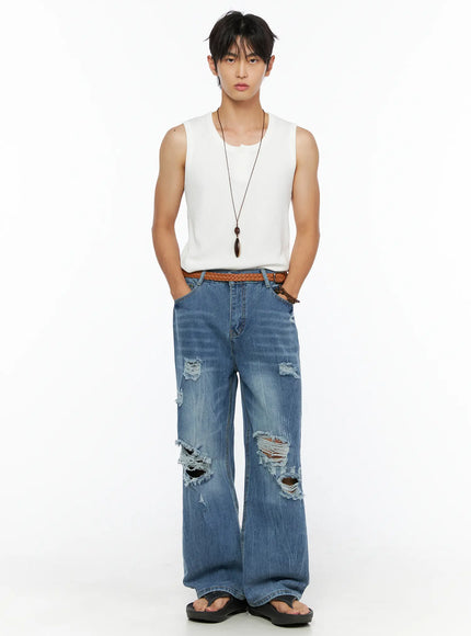 Men's Waffle Knit Henley Tank IL520 white full front shot on male model standing upright with hands at sides styled with blue ripped wide-leg denim and braided belt and necklace