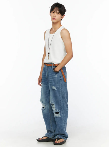 Men's Waffle Knit Henley Tank IL520 white three-quarter side shot on male model showing ribbed waffle texture and relaxed fit styled with blue distressed wide-leg jeans