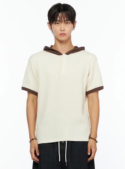 Men's Waffle Knit Hooded Henley Tee IL515 Light beige close-up front shot on male model showing brown hooded collar henley button placket and brown sleeve trim waffle texture