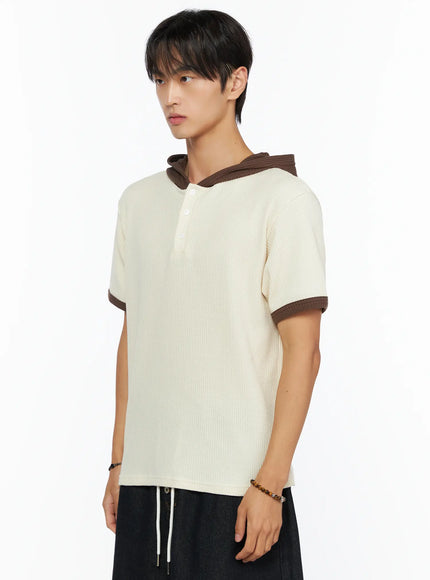 Men's Waffle Knit Hooded Henley Tee IL515 Light beige side shot on male model angled left showing brown contrast hood collar waffle knit texture and brown sleeve trim detail
