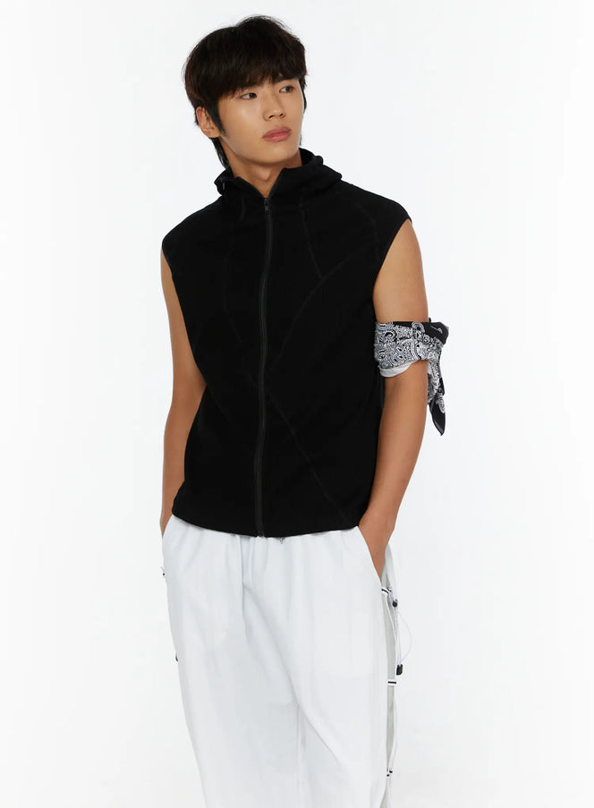 Men's Waffle Knit Zip-Up Sleeveless Hoodie IL515 Black front shot on model holding hood styled with white cargo pants and paisley armband accessory