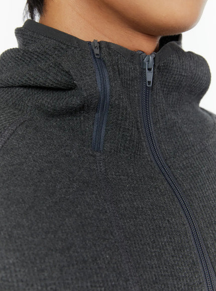 Men's Waffle Knit Zip-Up Sleeveless Hoodie IL515 dark close-up detail shot of zip pull hood neckline and waffle knit texture at collar area
