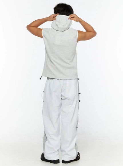 Men's Waffle Knit Zip-Up Sleeveless Hoodie IL515 Light gray back shot on model adjusting hood showing back panel waffle texture and drawcord hem detail