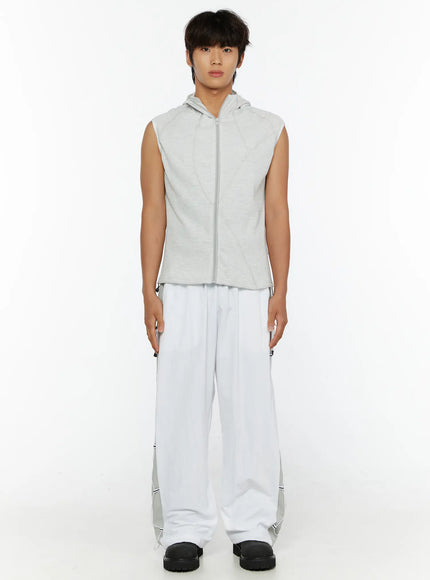 Men's Waffle Knit Zip-Up Sleeveless Hoodie IL515 Light gray full-body front shot on model standing straight styled with white wide-leg cargo pants