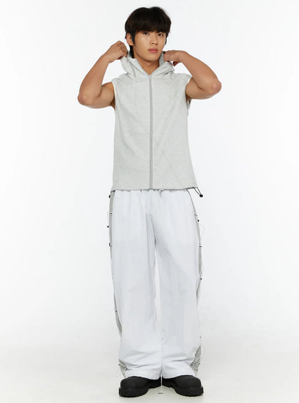 Men's Waffle Knit Zip-Up Sleeveless Hoodie IL515 Light gray full-body front shot on model with both hands gripping hood styled with white cargo pants