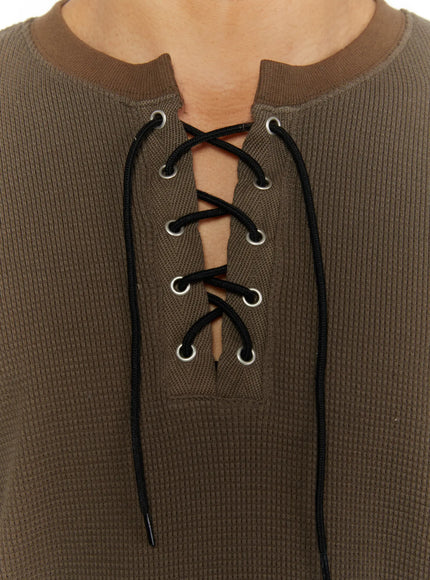 Men's Waffle Short Sleeve Tee IL515 Khaki close-up detail shot of lace-up neckline with silver eyelets and black cord on waffle knit fabric