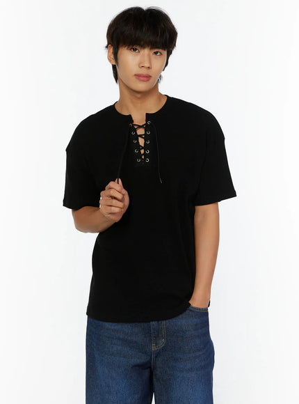 LEWKIN Men's Waffle Short Sleeve Tee IL515 Black close-up front shot on male model holding lace-up cord detail, paired with blue denim jeans