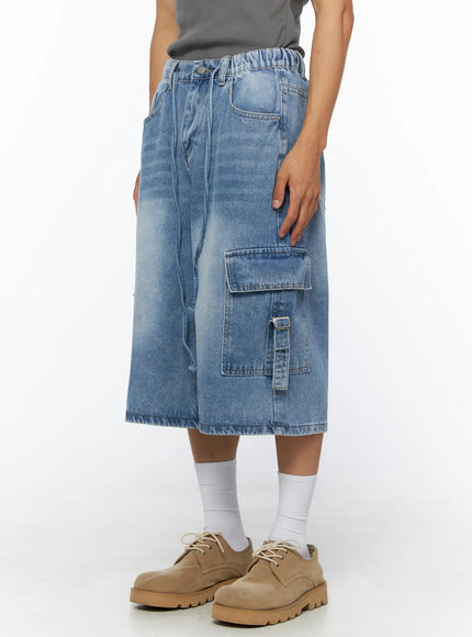 Men's Washed Cargo Jorts IL515 Light blue angled side view on model highlighting right cargo pocket with buckle strap and elastic waistband detail