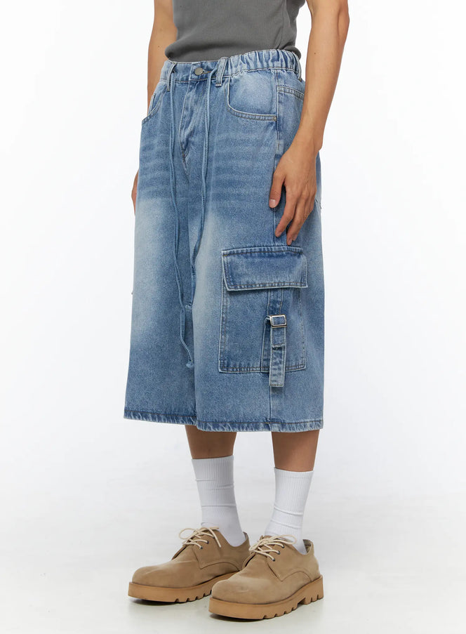 Men's Washed Cargo Jorts IL515 Light blue angled side view on model highlighting right cargo pocket with buckle strap and elastic waistband detail