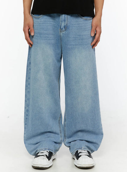 LEWKIN Men's Washed Wide Fit Jeans IL510 light blue front close-up on model showing wide-leg silhouette, faded wash denim, and gold stitching details