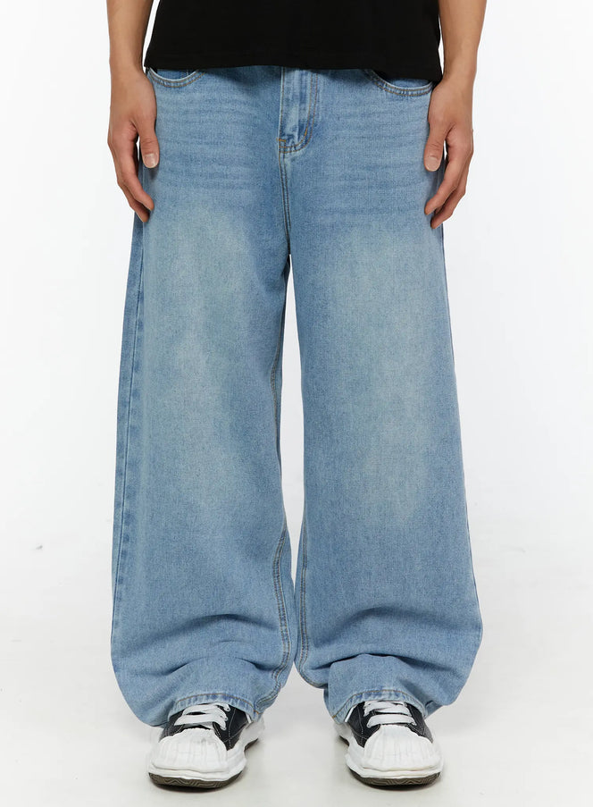 LEWKIN Men's Washed Wide Fit Jeans IL510 light blue front close-up on model showing wide-leg silhouette, faded wash denim, and gold stitching details