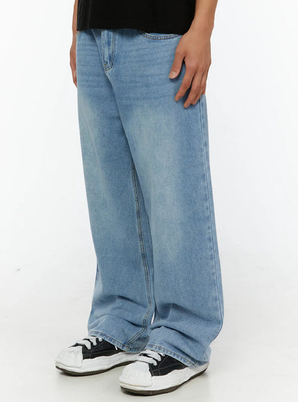 Men's Washed Wide Fit Jeans IL510 light blue side-angle close-up on model highlighting wide-leg cut, faded wash texture, and relaxed fit from hip to hem