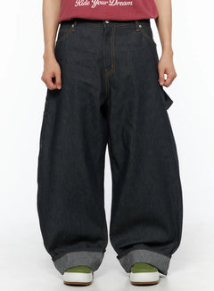 LEWKIN Men's Washed Wide Leg Jeans IL510 Black front crop shot on model wearing red tee, oversized balloon silhouette with orange contrast stitching and cuffed hem