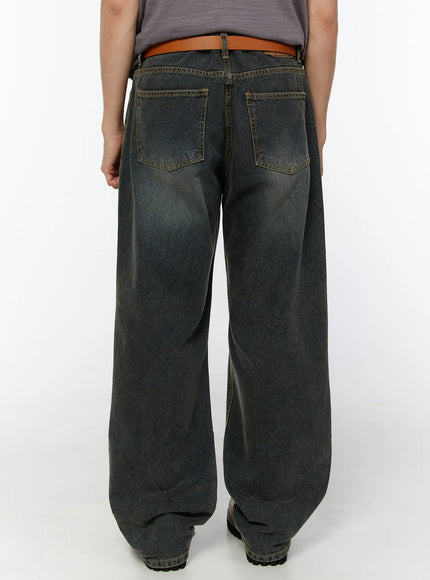 Men's Washed Wide Leg Jeans IU529 Dark blue back shot on model showing dual back pockets with gold stitching, brown belt, and chunky boots