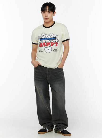 Men's Washed Wide Leg Jeans IU529 Dark blue full-body front shot on model in cream HAPPY bear ringer tee, hands in pockets, sneakers, wider stance